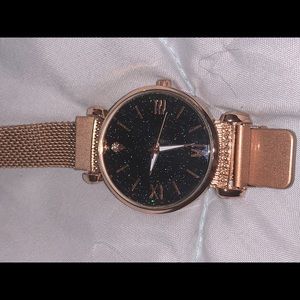 Rose Gold magnetic watch.